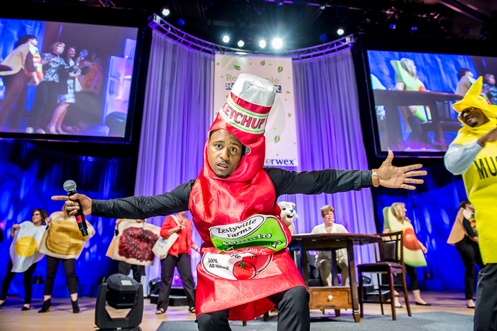 A performer dressed as a bottle of ketchup performs for the Norwex sales meeting in Minneapolis.