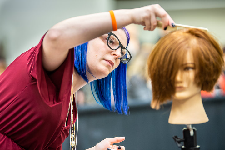 A Great Clips stylist works on her hair design as part of a styling contest at Great Clips' biannual convention in Minneapolis.