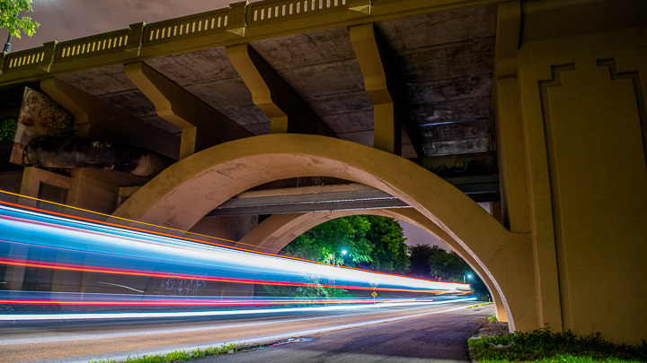 A bus blurs under a span of the newly refurbished Franklin Avenue bridge in Minneapolis.