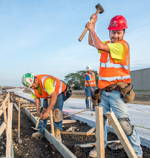 Workers prepare for a concrete pour along a new onramp on the Illinois Tollway system.