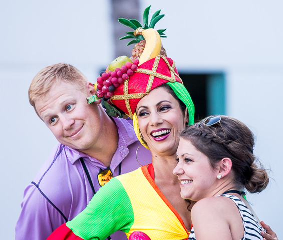 A couple pose with a Carmen Miranda impersonator at a corporate sales meeting in Hollywood, FL.