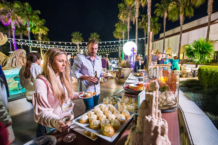 Attendees to a sales conference in Huntington Beach, CA, look over the options at the dessert buffet.