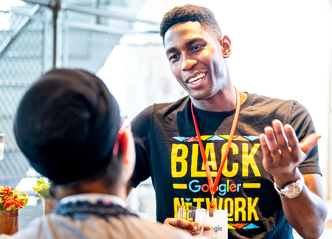 A Google employee answers questions from a prospective Google employee about what it's like to work at Google during a recruiting event in Minneapolis.
