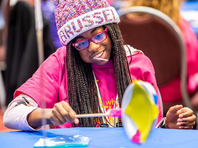 A girl works on a project during an 'Invent It Build It' event in Minneapolis sponsored by the Society of Women Engineers.