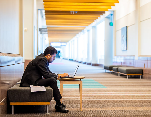 A makeshift desk lets a technology conference attendee catch up on email at the Minneapolis Convention Center.