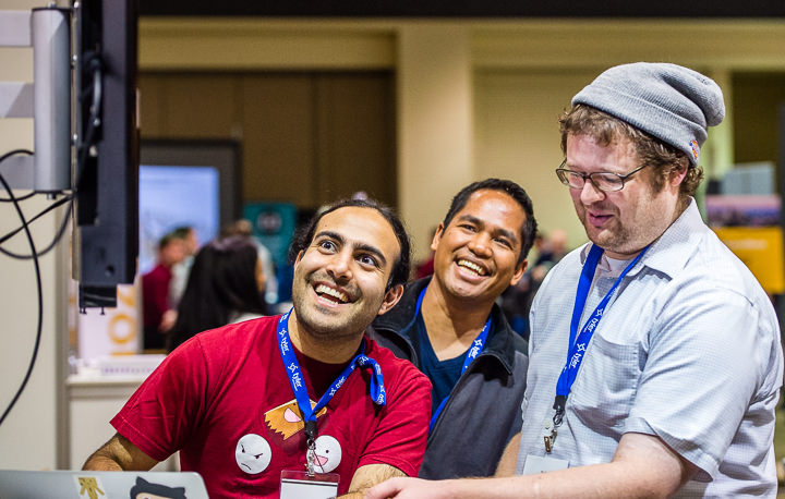 A group of hack-a-thon participants work on their project during a conference in Seattle.