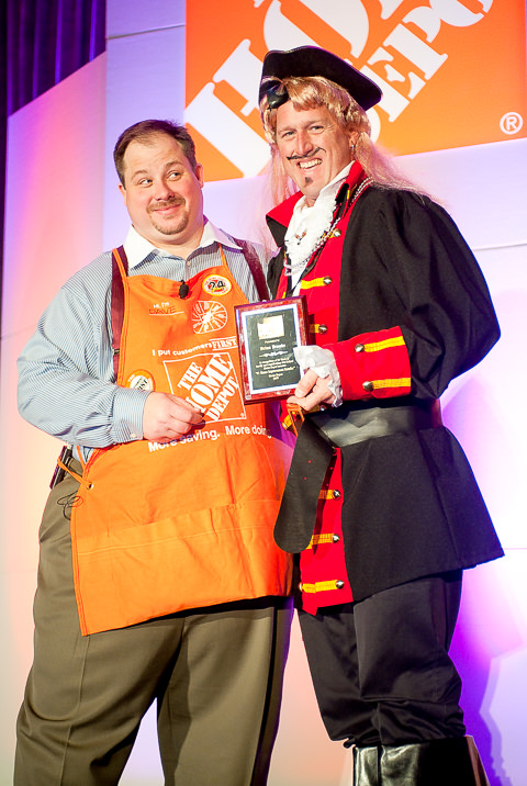At a Home Depot Sales meeting where store managers were encouraged to dress up as their favorite movie characters, a pirate receives a 20 year service award.