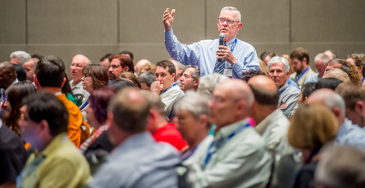 An association conference attendee in Atlanta asks a question from the audience.
