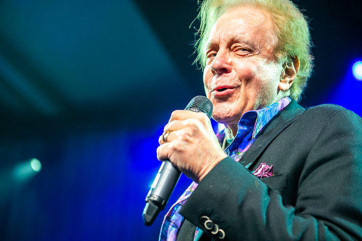 Eddie Money performs for a financial services audience outside Denver.