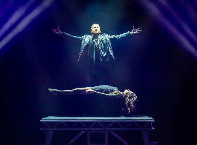 Illusionist Elliot Zimet performs his grand finale, levitating a woman.