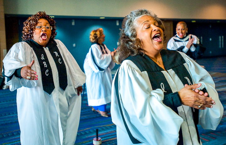 A gospel choir warms up backstage at the Morial Convention Center in New Orleans before performing for an association conference.