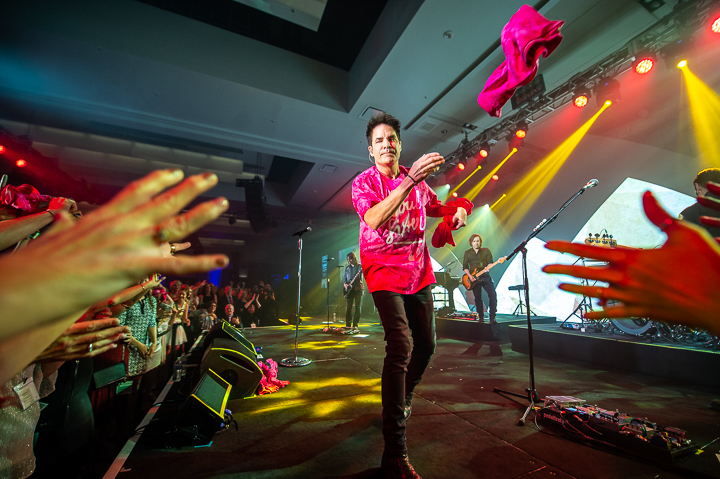 Patrick Monahan of the band Train tosses free t-shirts into the corwd at a corporate show in San Francisco.