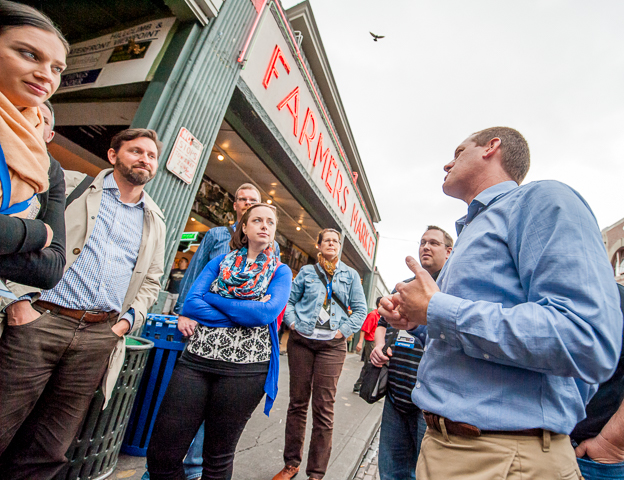 Association conference attendees get a walking tour of Seattle's iconic Pike Place Market.