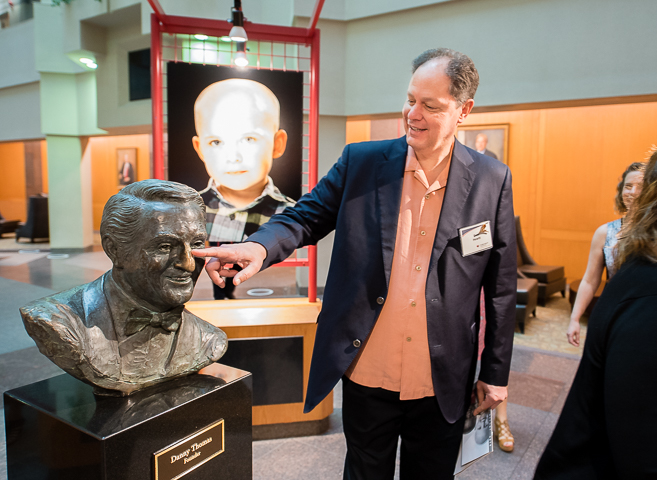A visitor to St Jude's Children's Research Hospital in Memphis rubs founder Danny Thomas' nose for good luck.