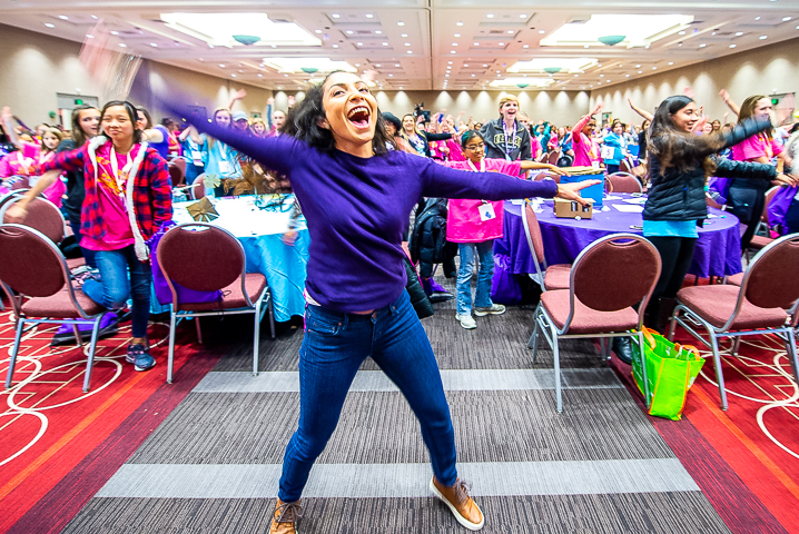 Deysi Melgar, host of the PBS show Design Squad Global, leads an exercise break during the Society for Women Engineers 'Invent It Build It' program for middle school and high school girls.