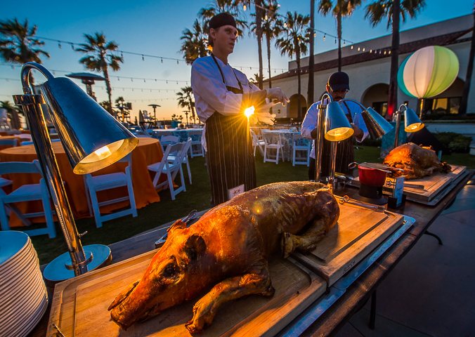 Chefs at the Hyatt Regency Hotel in Huntington Beach, CA wait for dinner guests before carving two roast pigs.