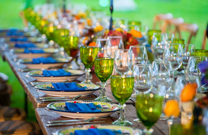 A long table set for a corporate leaders' dinner in the courtyard of a private hacienda in the Mexican state of Quintana Roo.