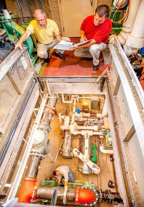 Technicians perform maintenance checks in the mechanical spaces of the Midtown Exchange building in Minneapolis.