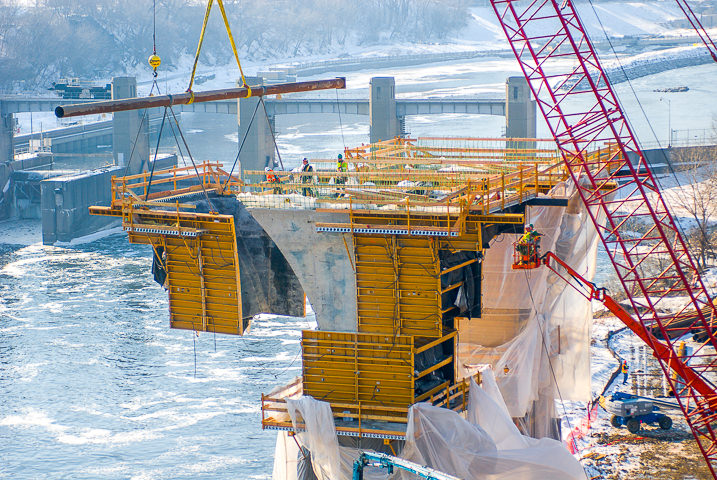 A form is pulled off the first pier of the new 35W road bridge over the Mississippi River in Minneapolis less than a year after the old bridge collapsed.