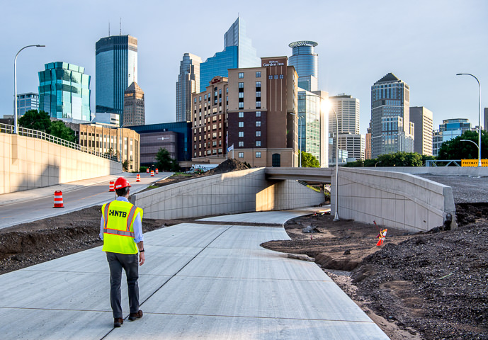 A drainage engineer inspects work on a new transit-only access ramp to Interstate 35W in downtown Minneapolis.